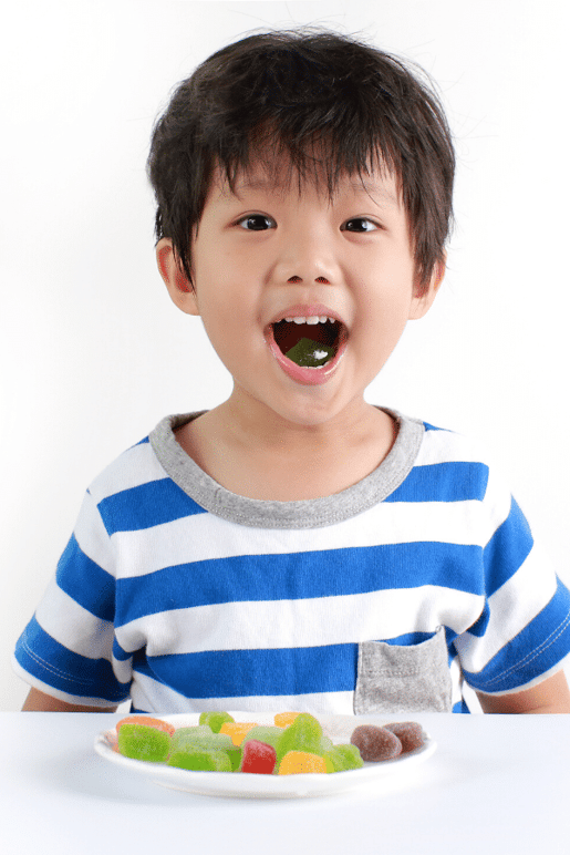 Child eating gummy candy